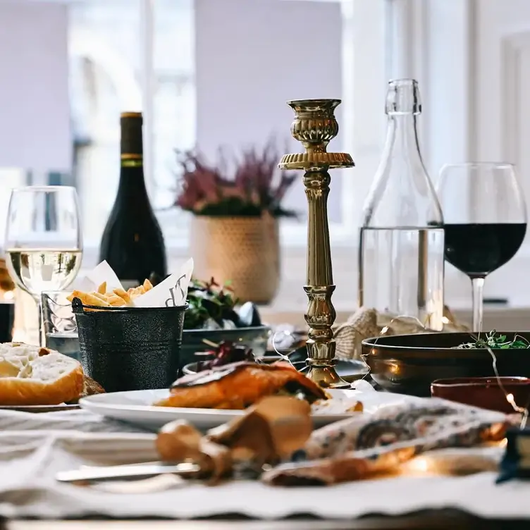 A table laid with food and wine at La Casa.