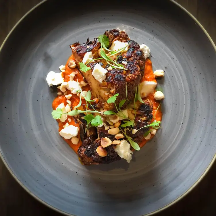 A grilled steak with charcoal-cooked cauliflower at Chop House Market Street, one of Edinburgh’s best date restaurants