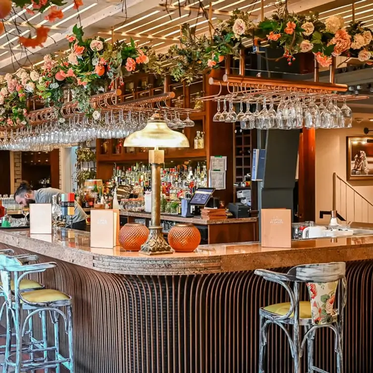 The bar with flower decorations at Copper Blossom, one of Edinburgh’s most romantic restaurants