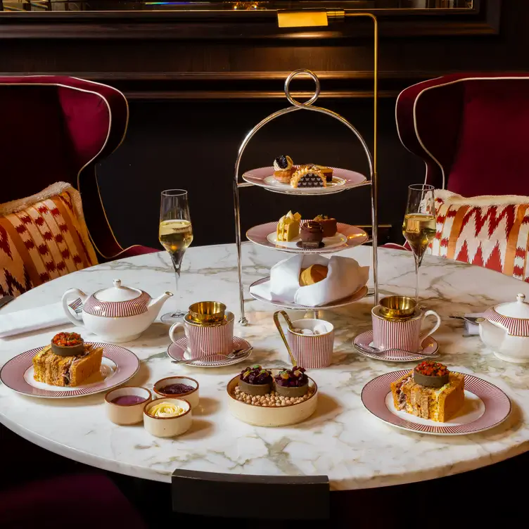 A table with an afternoon tea serving at The Madeleine Bar, one of the most romantic restaurants in Birmingham.