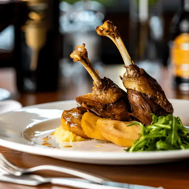 A crispy duck leg dish at Cucina Rustica, one of the best romantic restaurants in Birmingham.