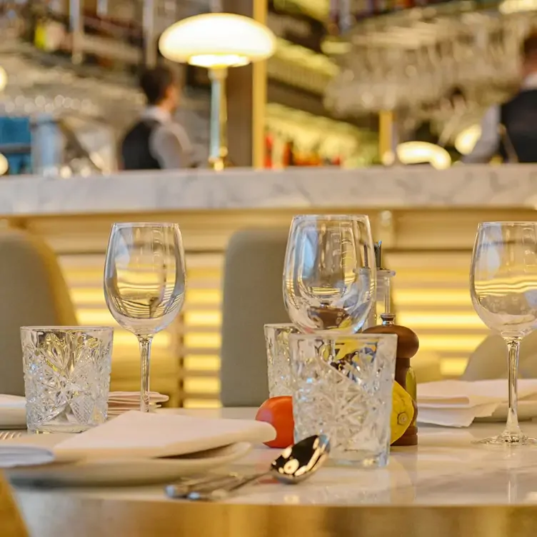 A table place setting with wine glasses at Fumo Restaurant on 4, in Birmingham.