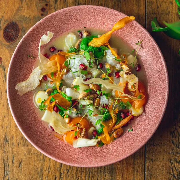 A colourful sea bass ceviche served in a pink bowl at Chakana, one of the best date night restaurants in Birmingham.