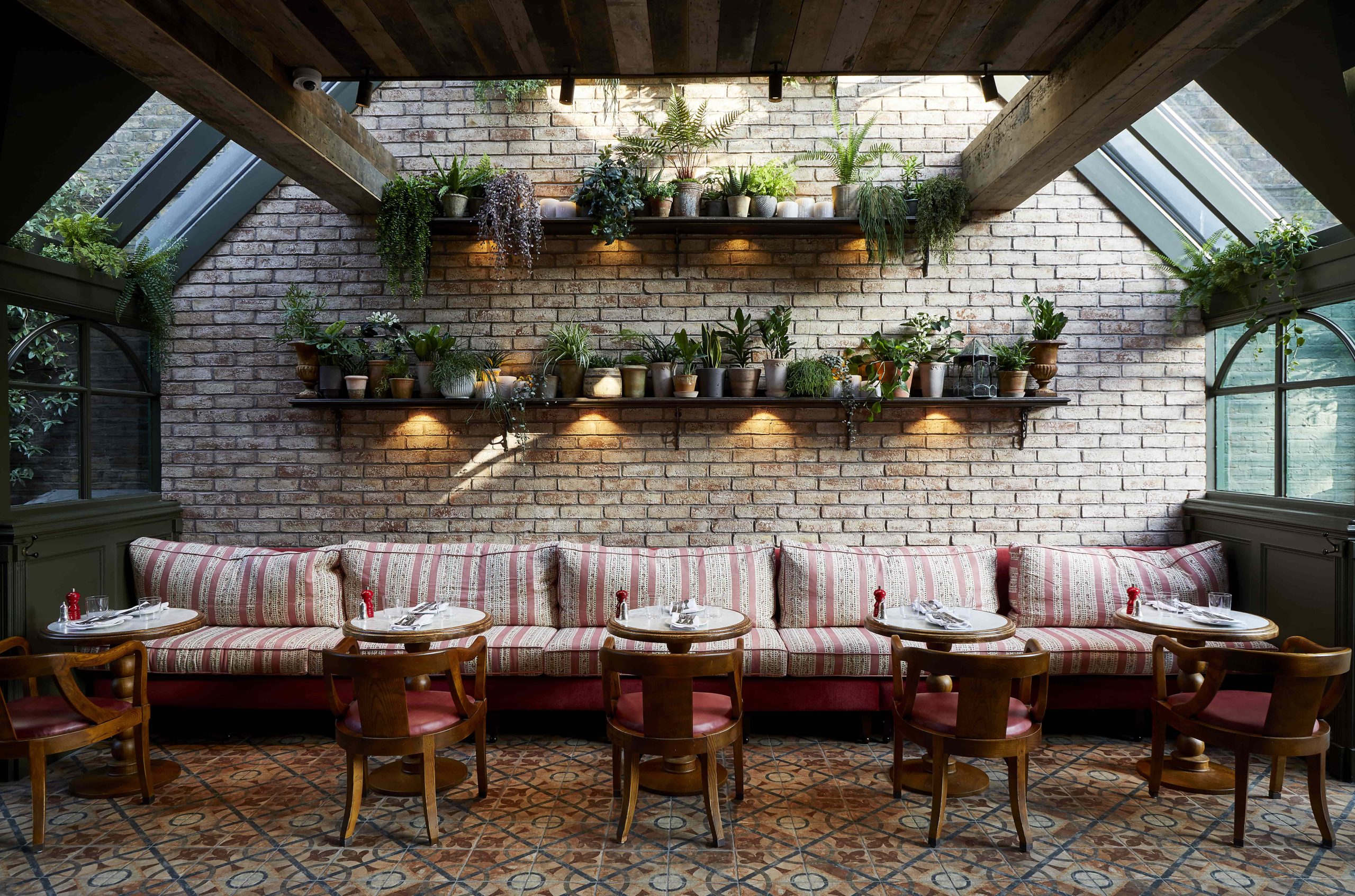 Charming settings and cosy atmosphere with plants and brick walls at Princess Royal, London