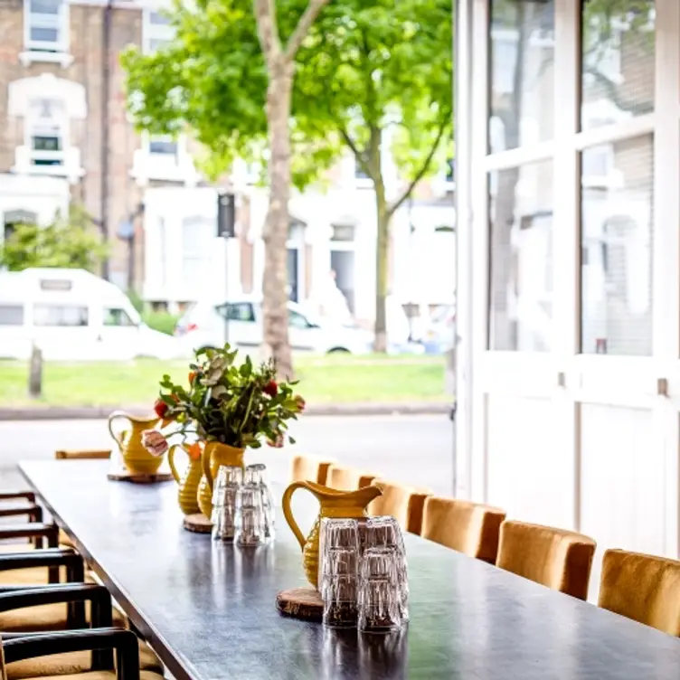 A large communal table at Primeur in Stoke Newington, one of the best romantic restaurants in London