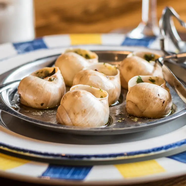 A dish of escargots at Toulouse Lautrec Restaurant & Jazz Club, one of the best romantic restaurants in London