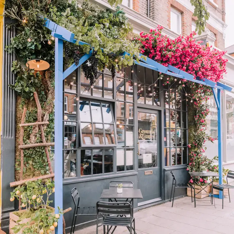 The flower-filled facade at Grounds & Grapes, a restaurant in London