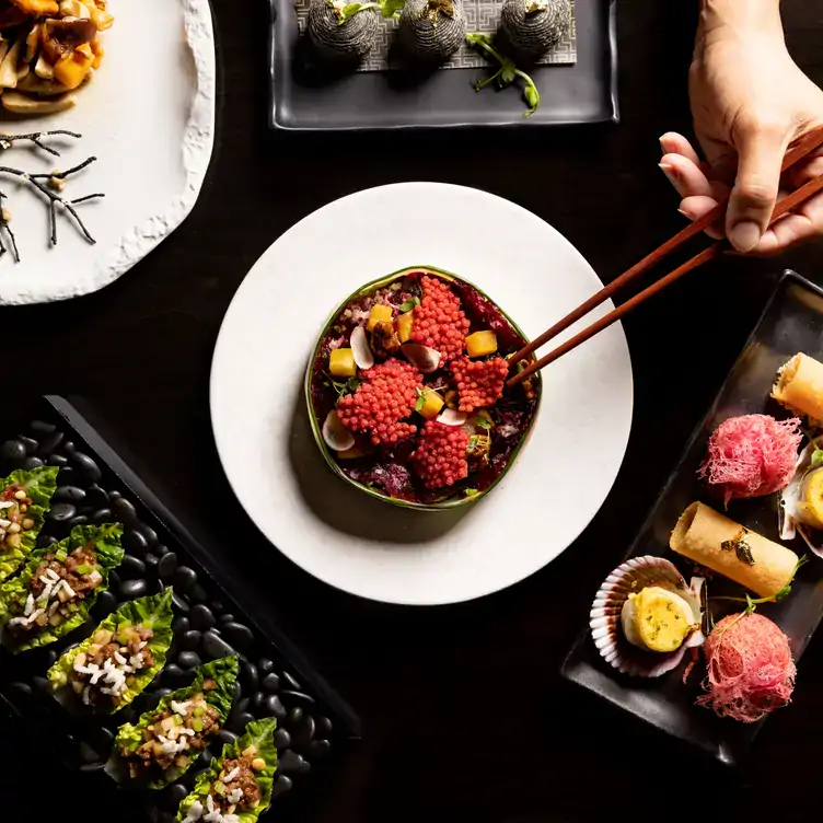 A spread of Chinese-inspired dishes at Hakkasan, one of the best Chinese restaurants in London