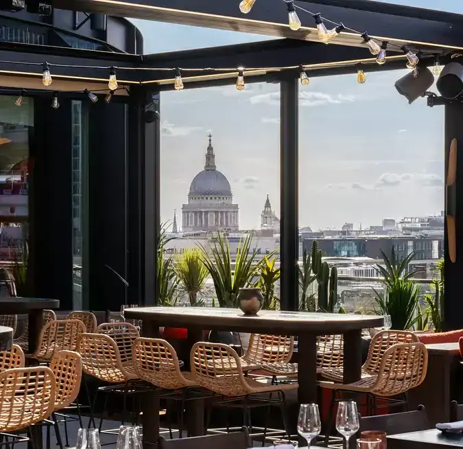 The outdoor rooftop terrace with views over St Pau;'s Cathedral at Los Mochis London, one of the best rooftop bars and restaurants in London