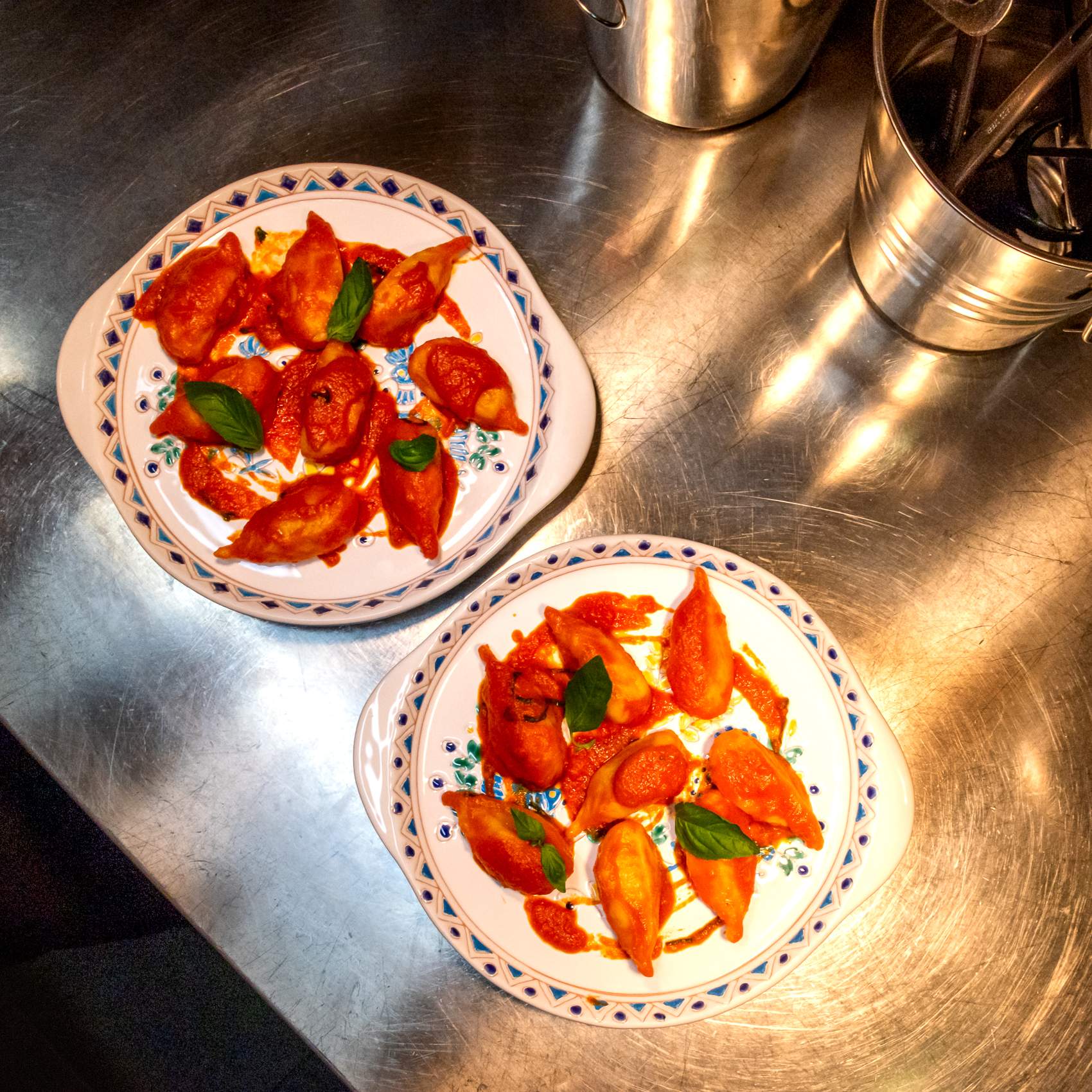 Stuffed pasta shells sit on two plates garnished with basil at Wallace’s Asti, a restaurant in Dublin