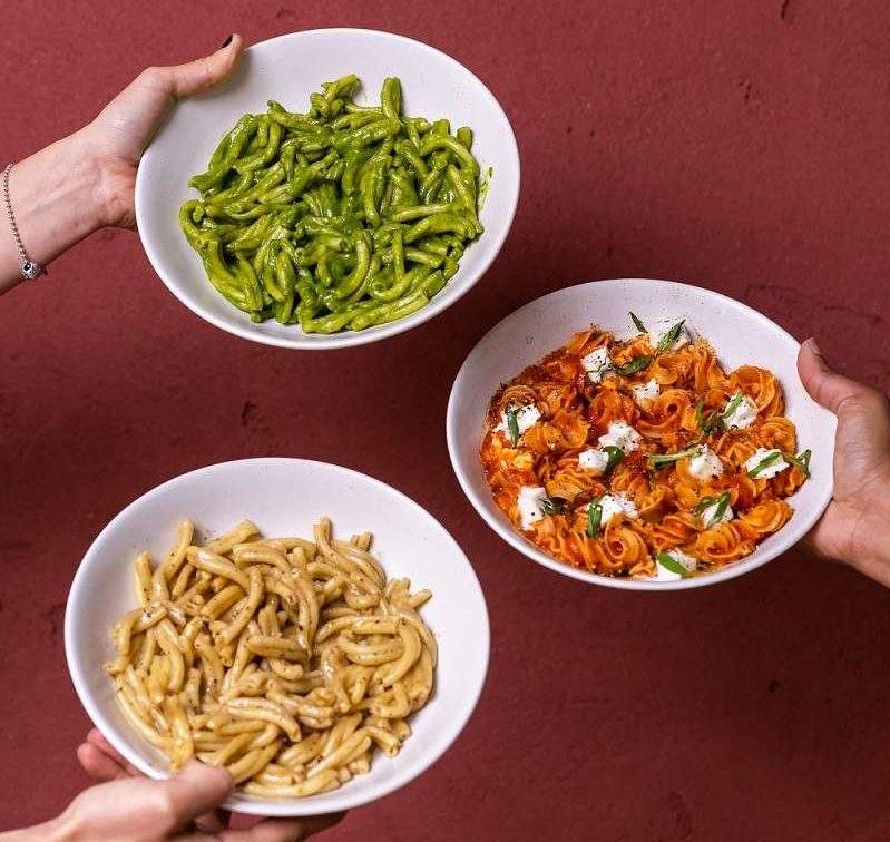 An array of pasta dishes with different sauces at Emilia's Crafted Pasta, one of the best Italian restaurants in London.