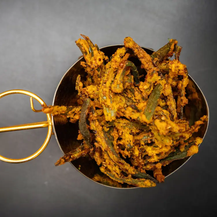 Crispy fried okra served in a metal serving bowl at Hungamaa, one of the best Indian restaurants in Manchester. Credit: Hungamaa