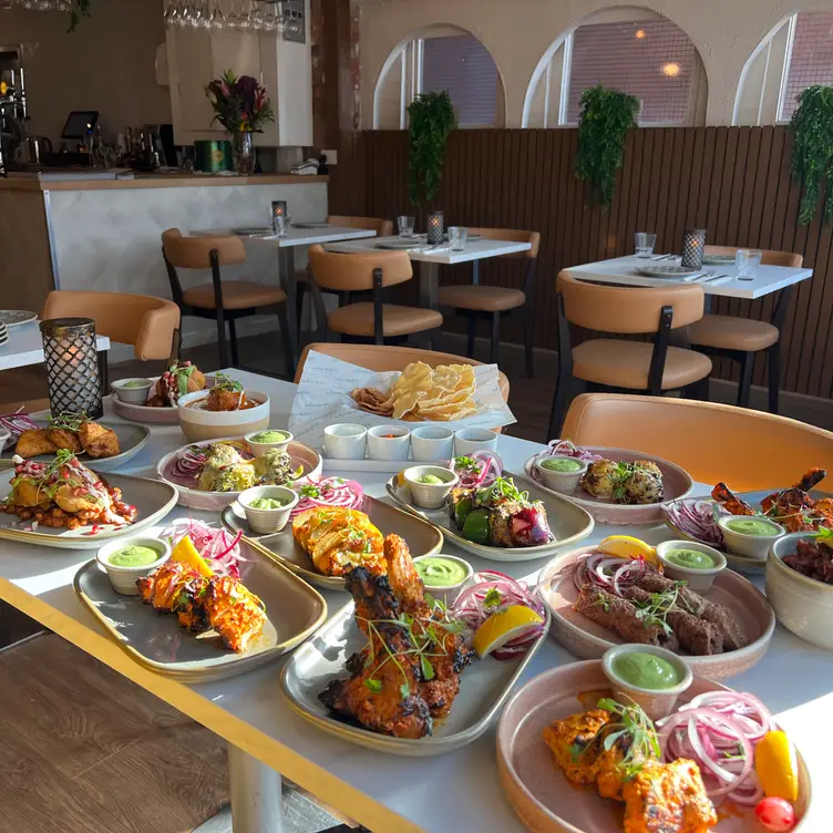 A table of various colourful dishes at Indian Affair, one of the best Indian restaurants in Manchester. Credit: Indian Affair