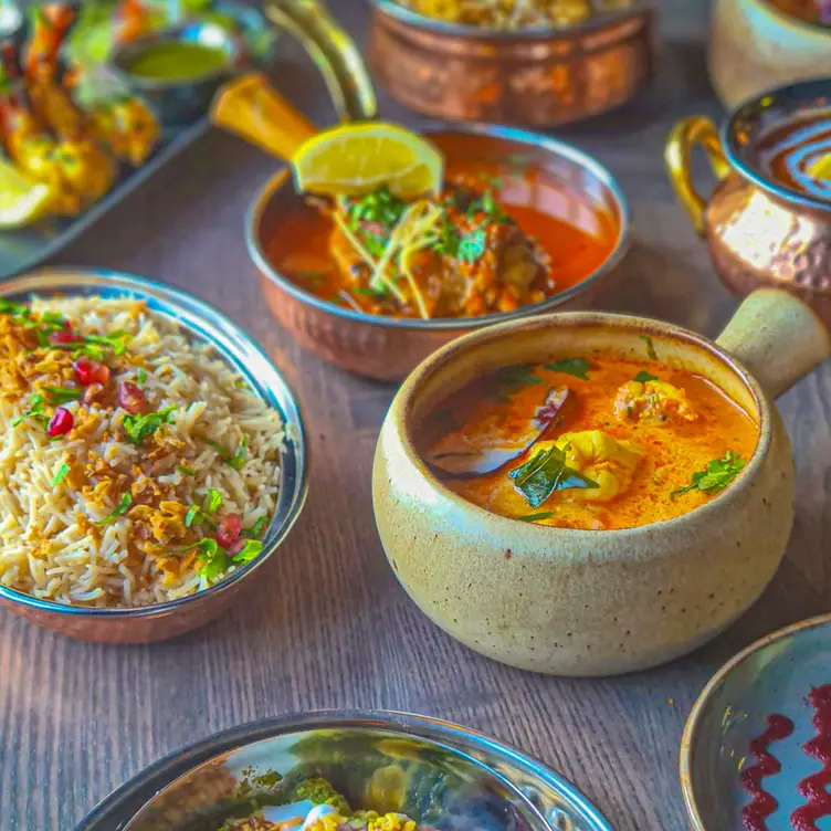 An array of traditional Indian delicacies laid out on the table at Jajoo, one of the best Indian restaurants in Manchester. Credit: Jajoo Indian Street Food