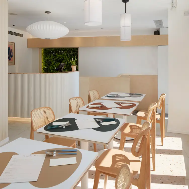 Tables, chairs and the interior of the restaurant at Barn Ju.