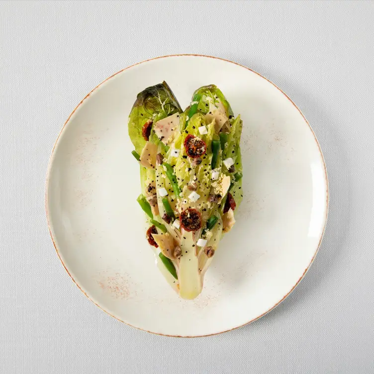 A well-garnished and decorated romaine lettuce on a plate at Bibendum Oyster Bar, one of the best seafood restaurants in London.