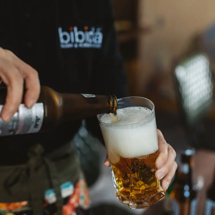 A beer being poured at Bibida, one of the best Korean restaurants in London.