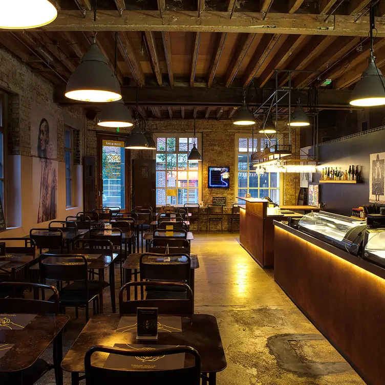 The restaurant’s layout with seating and a bar area at Michiko Sushino.