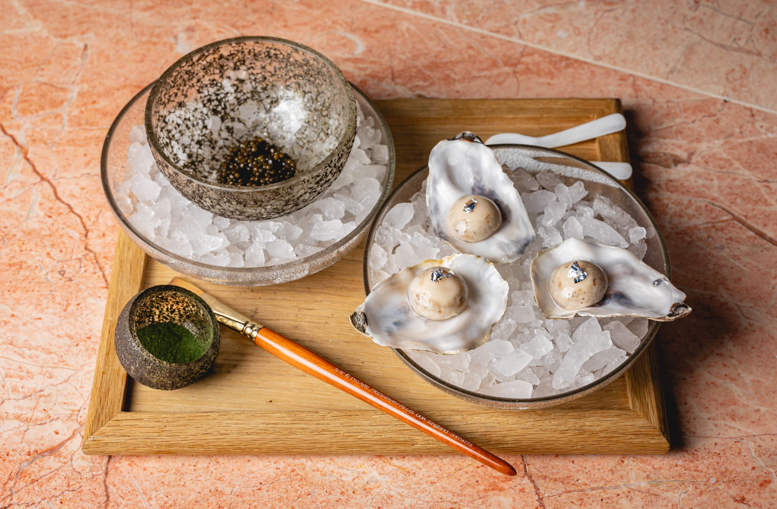 A MICHELIN-starred dish featuring caviar and oyster at Hélène Darroze at The Connaught, one of the best hotel restaurants in London