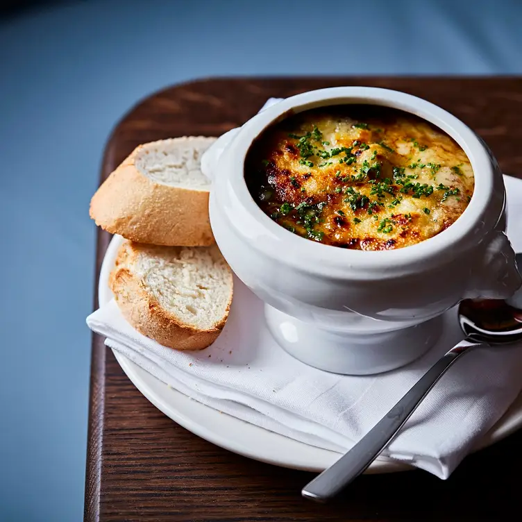 Onion soup and bread at Richoux London, one of the best French restaurants in London