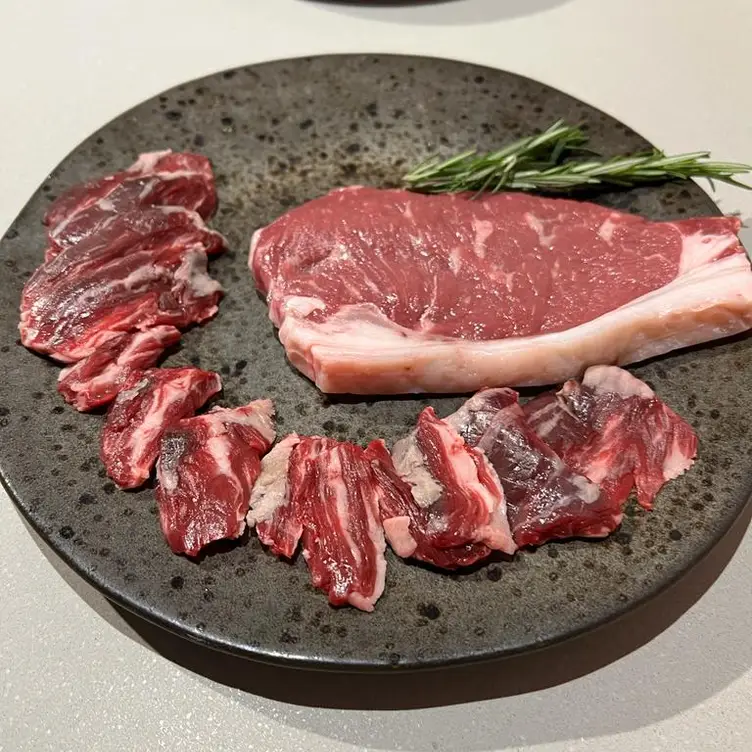 Fresh cuts of meat ready to cook at Korean BBQ & Vegan Restaurant, one of the best Korean restaurants in London.