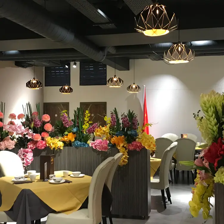 Flowers, tables and chairs at Pinwei Chinese Restaurant.