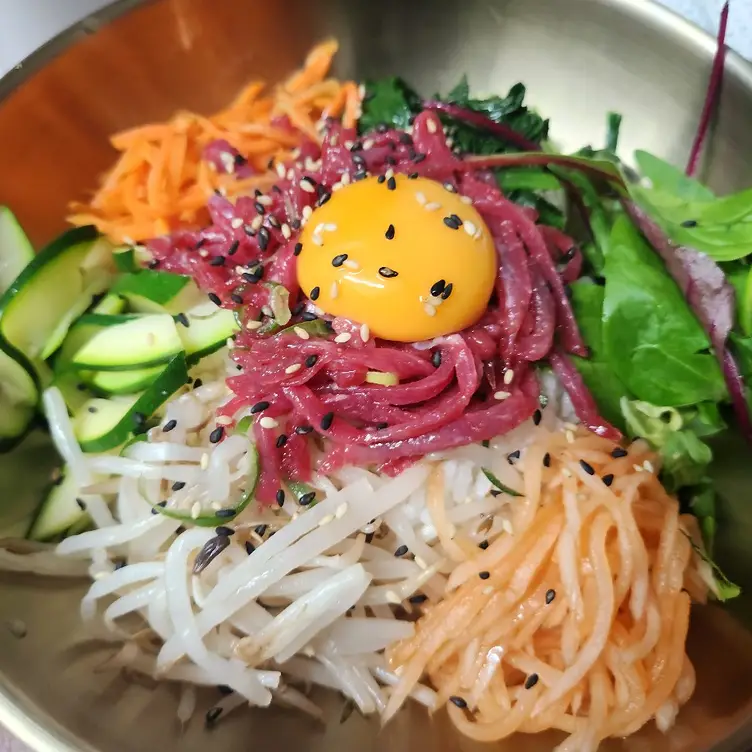 A range of colourful foods, including egg, beetroot, cucumber and beansprouts at Barn Ju.