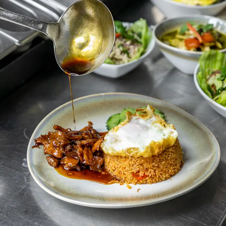 Food being prepared at Thai Taste Restaurant.