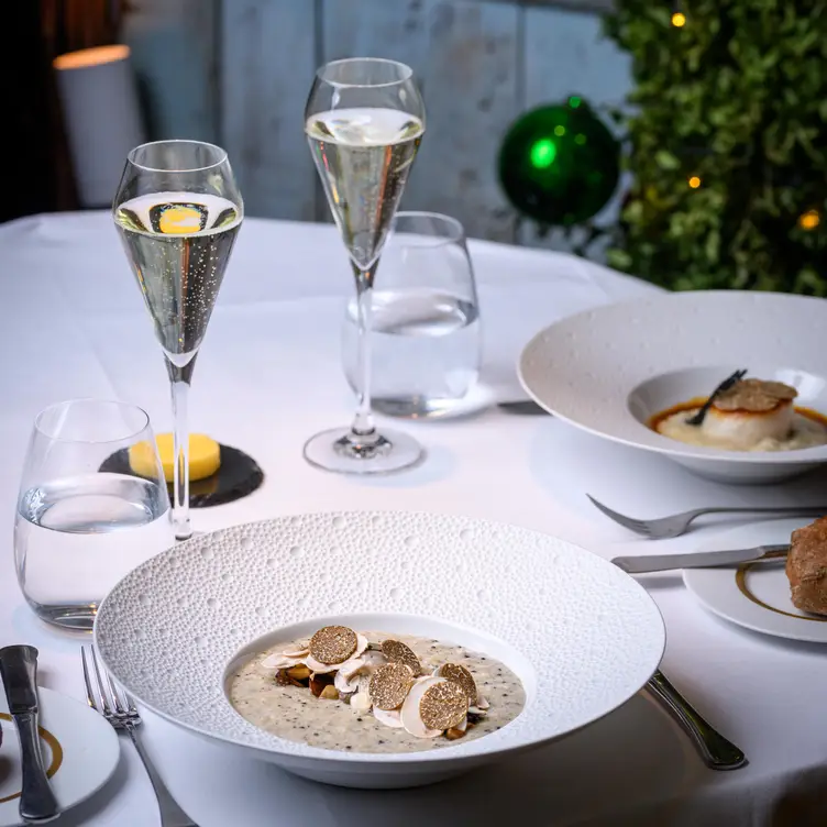 A table with food and drinks at Clos Maggiore, in London.