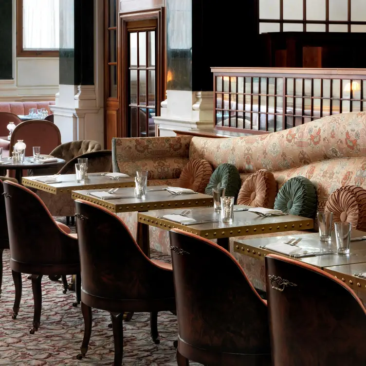 The cosy interiors of Millie’s Lounge at The Ned London, one of the best hotel restaurants in London