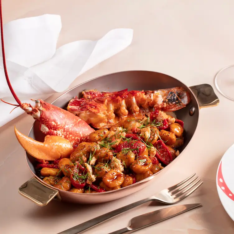 A lobster gnocchi in a metal dish at Gattopardo in London.