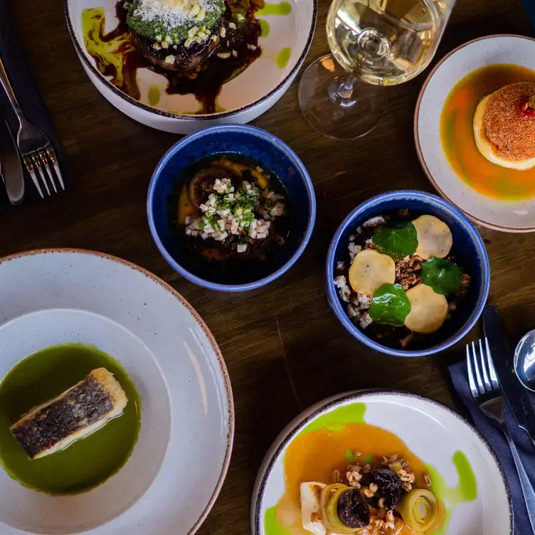 A table of colourful seafood dishes at KELP, one of the best romantic restaurants in Glasgow.