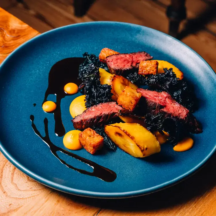 A colourful dish of roasted duck breast and vegetables at Number 16 Restaurant, one of the best romantic restaurants in Glasgow.