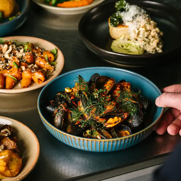 A table of seafood dishes at iasg restaurant at the Blythswood, one of the best romantic restaurants in Glasgow.