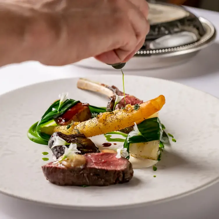 A fine dining plate featuring meat and vegetables at The Ledbury in London