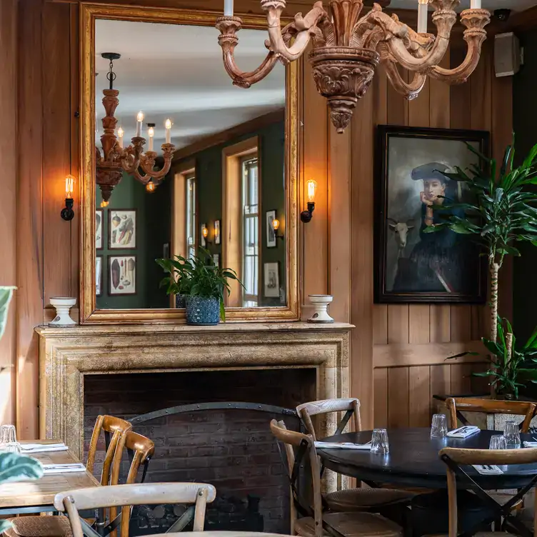 A mirror, chandelier and painting at The Grazing Goat Pub & Boutique Hotel Marylebone, one of the best pubs in London.