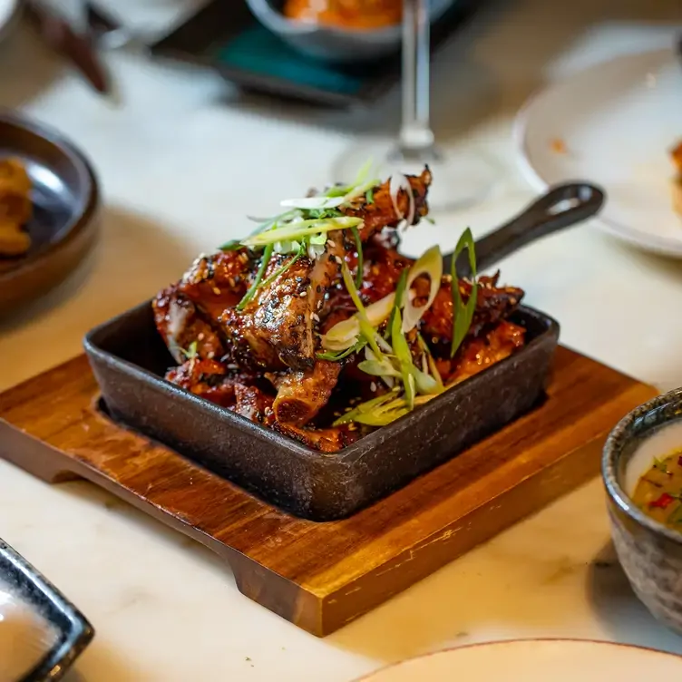 A meat starter with spring onions on top at Leicester Square Kitchen, one of the best Mexican restaurants in London.