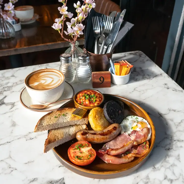 A fry up with sausages and bacon at Edison Bar, one of the best brunch spots in Manchester.