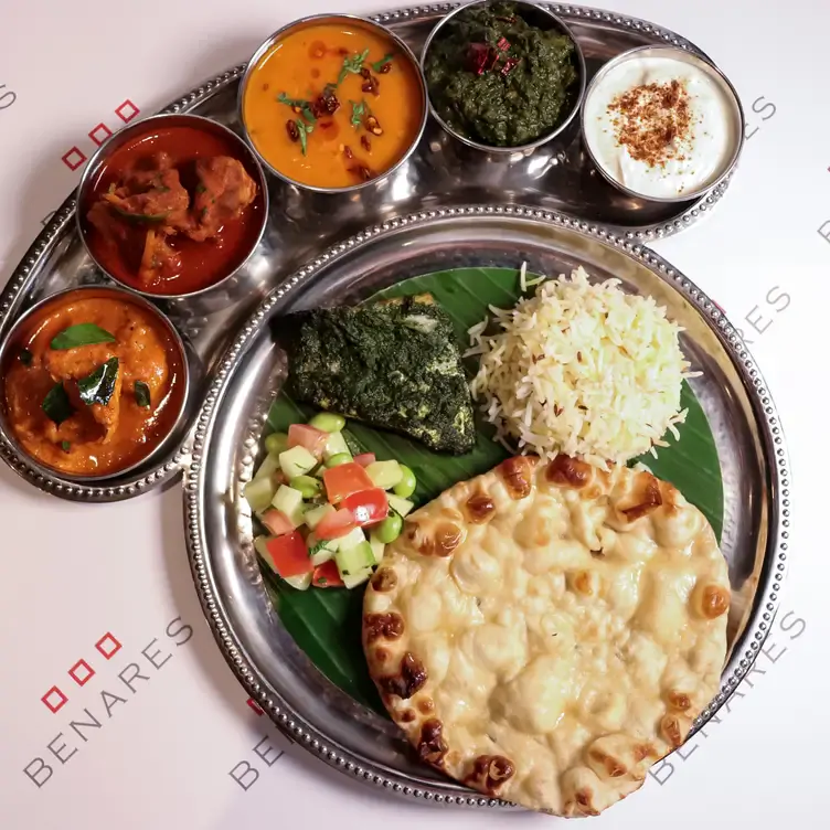 Flatbread served alongside salad, rice and several different tasting bowls at Benares, one of the best MICHELIN restaurants in London.