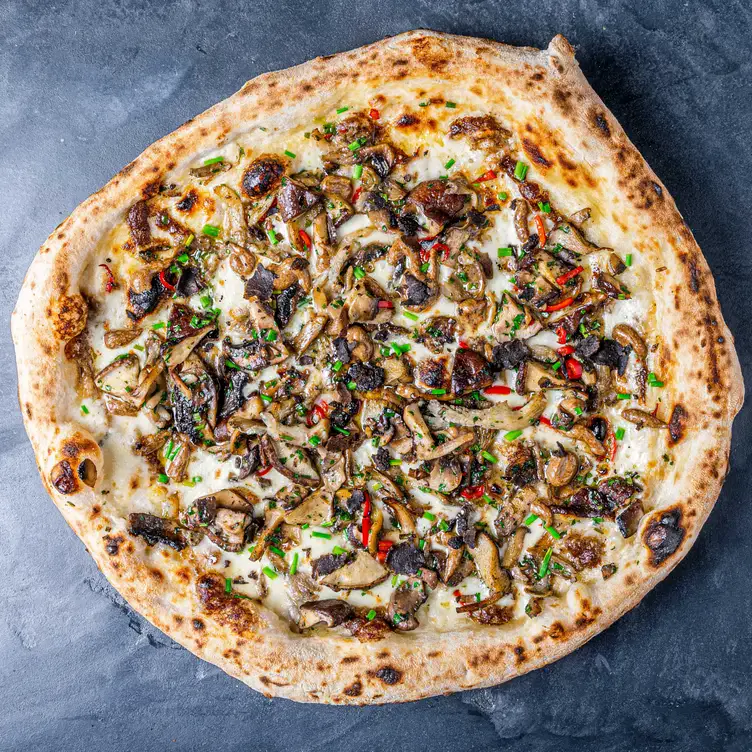 A mushroom pizza with a tomato free base at Carluccio’s – Solihull, one of the best brunch restaurants in Birmingham.