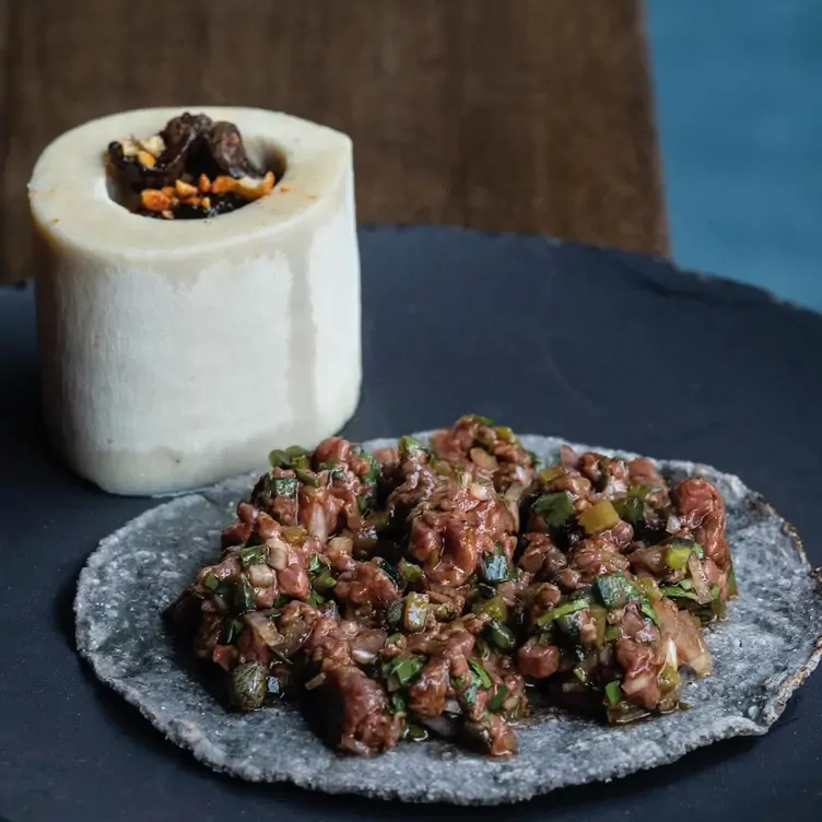 A dish consisting of refried beans at zapote, one of the best Mexican restaurants in London.