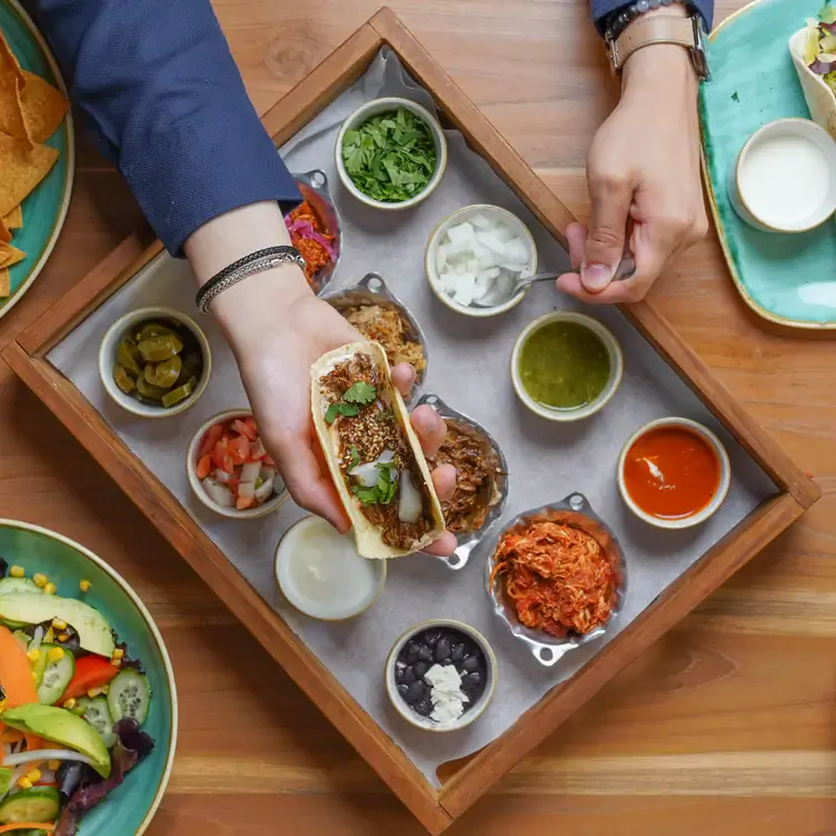 A taco and a range of dips at Mestizo, one of the best Mexican restaurants in London.