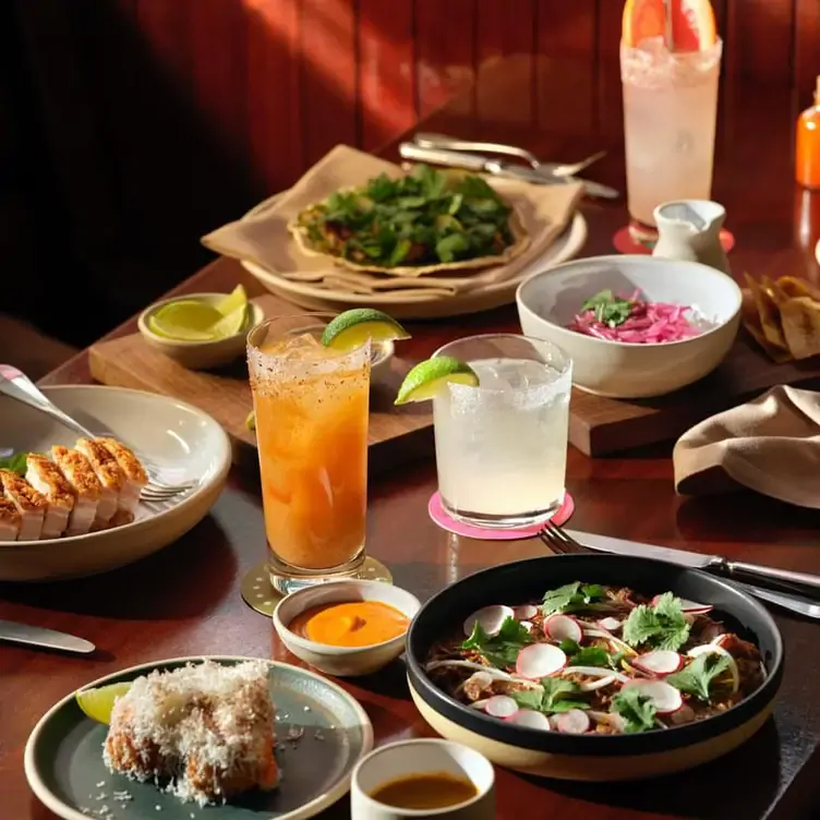 A range of dishes, including starters, drinks and a main, at Side Hustle at The NoMad.