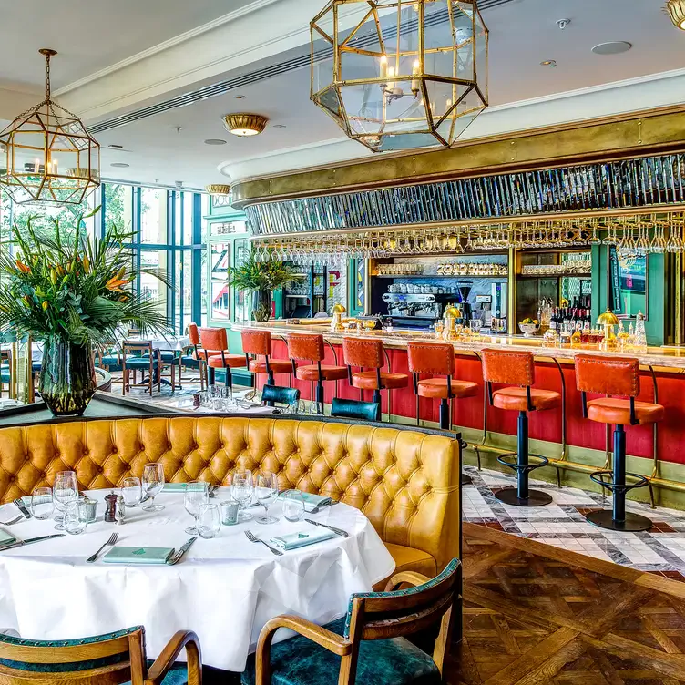 The restaurant floor and the bar at The Ivy on the Square, one of the best brunch spots in Edinburgh.