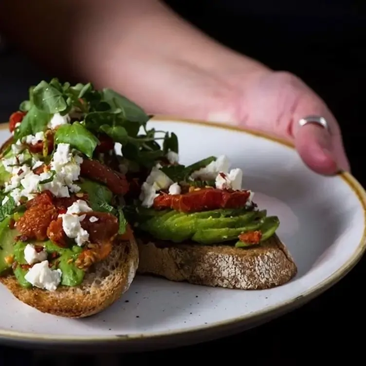 Avocado toast with tomatoes and feta cheese at Urban Angel in Edinburgh.