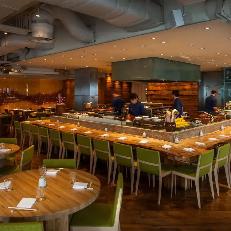 The modern open plan of the restaurant and kitchen at ROKA, one of the best fancy restaurants in London.