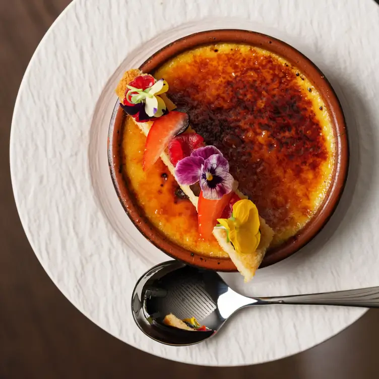 A crème brulee with edible flowers at Morrison Grill at the Morrison Hotel, one of Dublin’s best brunch places.