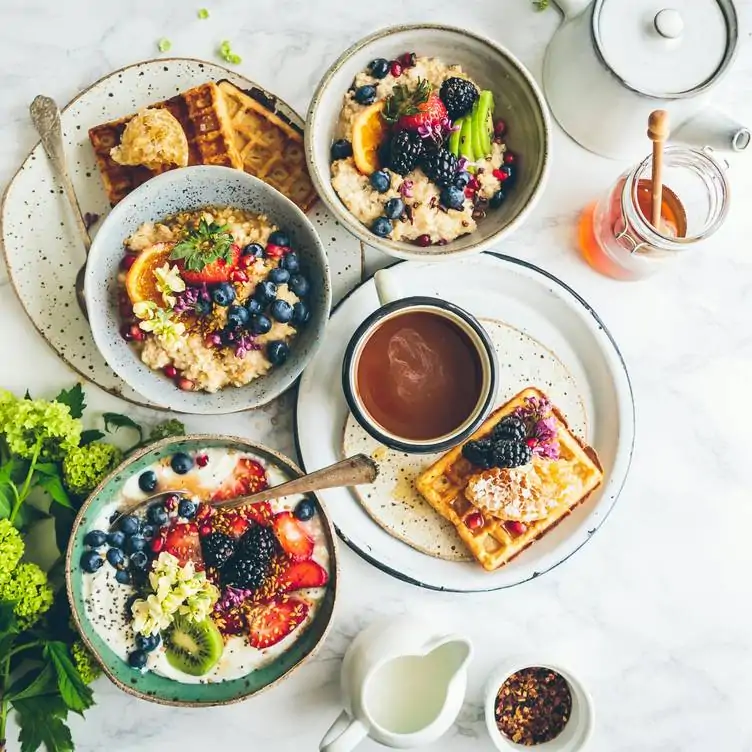 A beautifully arranged brunch spread with waffles, fresh fruit, and granola, capturing the essence of the best brunch in Birmingham.