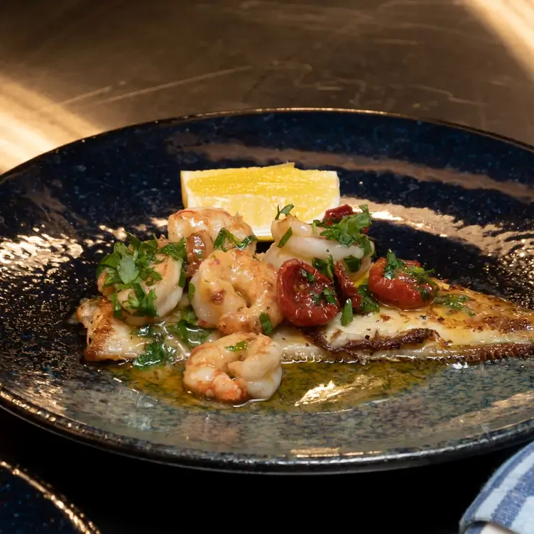 A plate of prawns and cherry tomatoes served at House Dublin, one of the best pubs in Dublin.