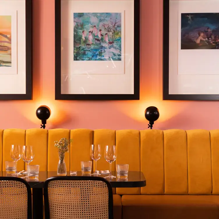 A wall table set with glasses at Lottie's, one of the best restaurants in Dublin.